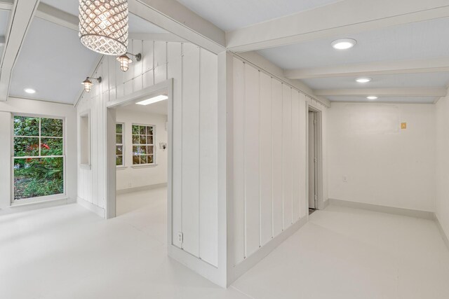 180 E Mitchell Ave, Santa Rosa Beach, FL 32459 - hallway with recessed lighting, beamed ceiling, and concrete flooring