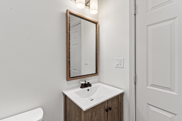 180 E Mitchell Ave, Santa Rosa Beach, FL 32459 - half bathroom featuring vanity and toilet