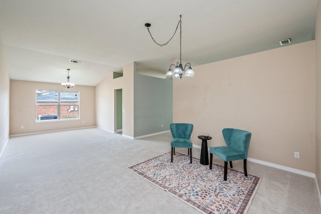 488 Jillian Dr, Crestview, FL 32536 - living area featuring a chandelier, carpet floors, and vaulted ceiling
