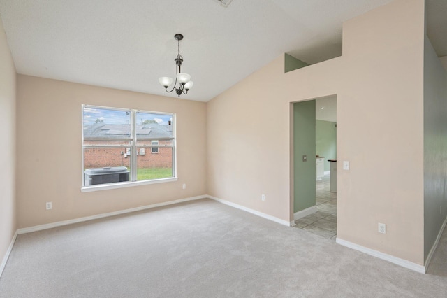 488 Jillian Dr, Crestview, FL 32536 - carpeted empty room with lofted ceiling and a chandelier