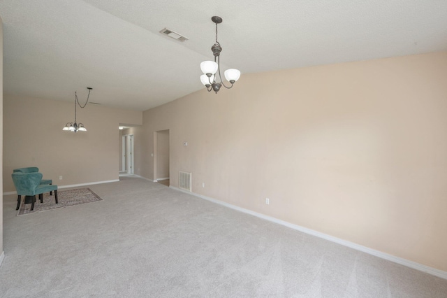 488 Jillian Dr, Crestview, FL 32536 - unfurnished room with a chandelier, light colored carpet, and vaulted ceiling