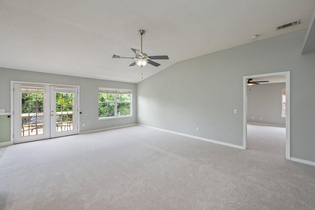488 Jillian Dr, Crestview, FL 32536 - unfurnished room featuring ceiling fan, carpet flooring, vaulted ceiling, french doors, and a smoke detector