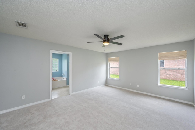 488 Jillian Dr, Crestview, FL 32536 - unfurnished room featuring a ceiling fan, carpet flooring, and a textured ceiling