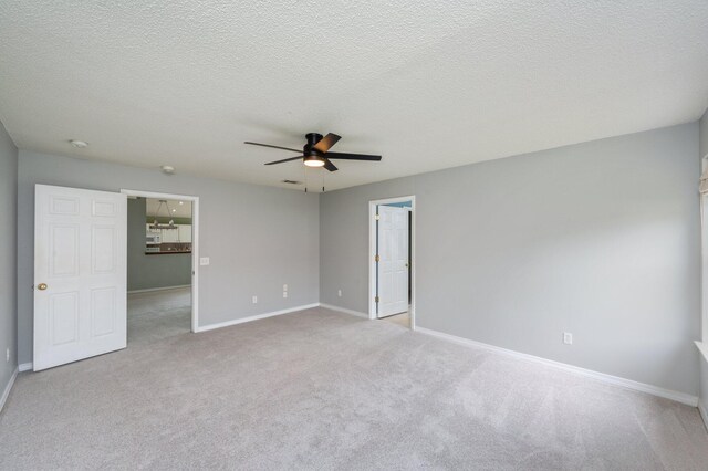 488 Jillian Dr, Crestview, FL 32536 - unfurnished bedroom with carpet floors, a textured ceiling, ceiling fan, and a spacious closet