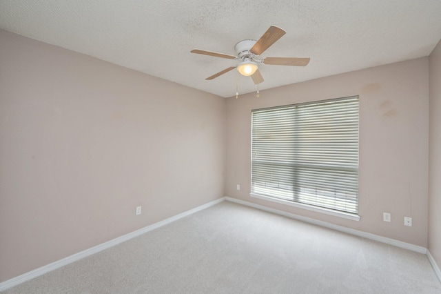 488 Jillian Dr, Crestview, FL 32536 - empty room featuring light carpet, a ceiling fan, and a textured ceiling