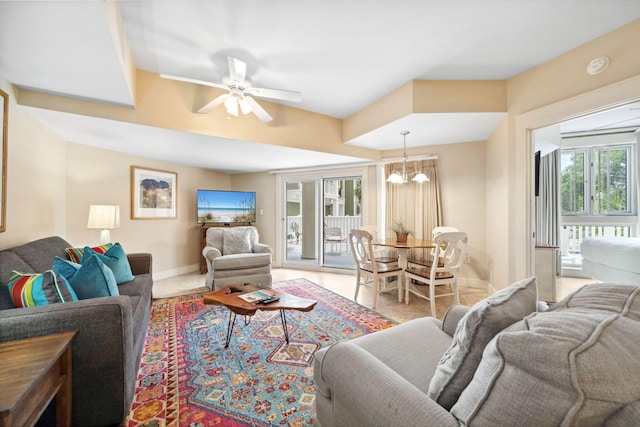9100 Baytowne Wharf Blvd Unit 261, Miramar Beach, FL 32550 - living area featuring ceiling fan, a chandelier, and baseboards