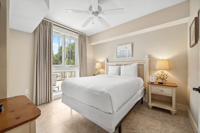 9100 Baytowne Wharf Blvd Unit 261, Miramar Beach, FL 32550 - bedroom with ceiling fan, baseboards, and light tile patterned flooring