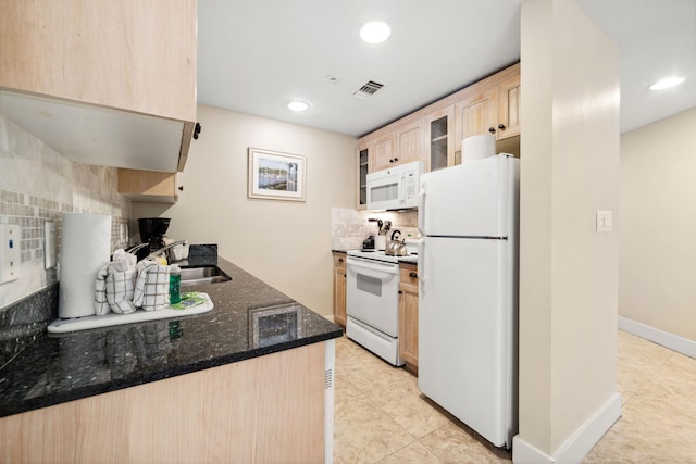 9100 Baytowne Wharf Blvd Unit 261, Miramar Beach, FL 32550 - kitchen with white appliances, light brown cabinetry, a sink, tasteful backsplash, and light tile patterned floors