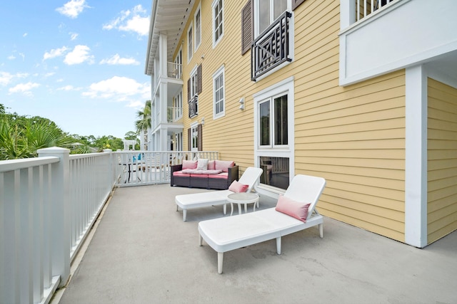 9100 Baytowne Wharf Blvd Unit 261, Miramar Beach, FL 32550 - view of patio / terrace with a balcony and an outdoor living space