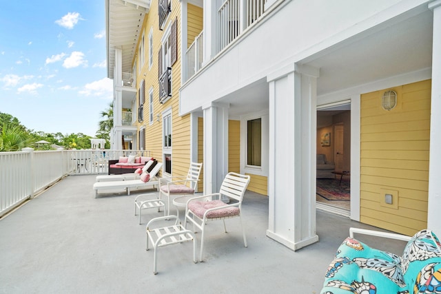 9100 Baytowne Wharf Blvd Unit 261, Miramar Beach, FL 32550 - view of patio with an outdoor living space and a balcony
