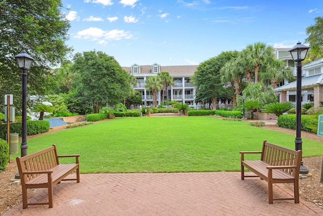 9100 Baytowne Wharf Blvd Unit 261, Miramar Beach, FL 32550 - view of property's community with a patio area and a lawn