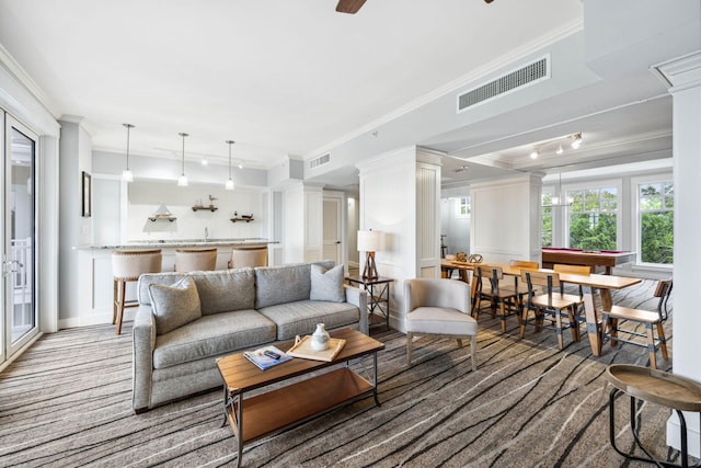 9100 Baytowne Wharf Blvd Unit 261, Miramar Beach, FL 32550 - carpeted living area with crown molding and a decorative wall