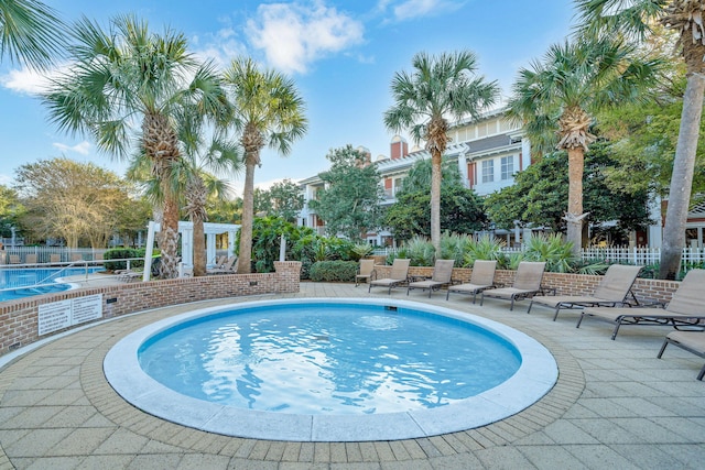 9100 Baytowne Wharf Blvd Unit 261, Miramar Beach, FL 32550 - community pool featuring a patio area