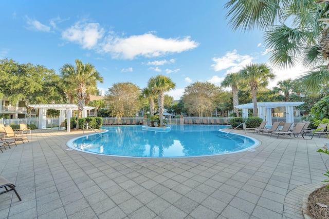 9100 Baytowne Wharf Blvd Unit 261, Miramar Beach, FL 32550 - community pool with a pergola and a patio area