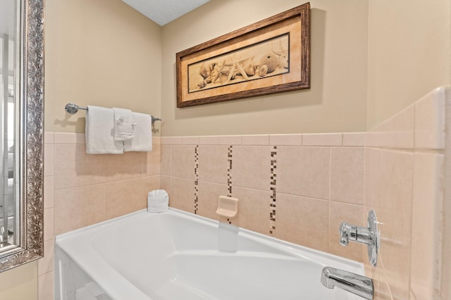 11800 Front Beach Rd Unit 1301, Panama City Beach, FL 32407 - bathroom featuring a bath and wainscoting