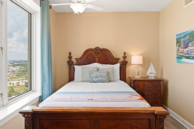11800 Front Beach Rd Unit 1301, Panama City Beach, FL 32407 - bedroom with wood finished floors, baseboards, and a ceiling fan