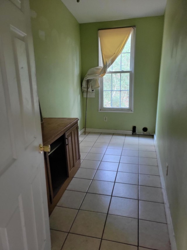 1989 Juniper Lake Rd, Defuniak Springs, FL 32433 - laundry area with light tile patterned floors and baseboards