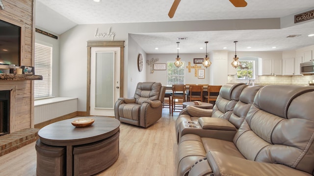 241 Mullet Dr, Freeport, FL 32439 - living area featuring a ceiling fan, light wood-style flooring, a brick fireplace, recessed lighting, and lofted ceiling