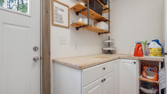 241 Mullet Dr, Freeport, FL 32439 - kitchen featuring open shelves, white cabinets, and light countertops