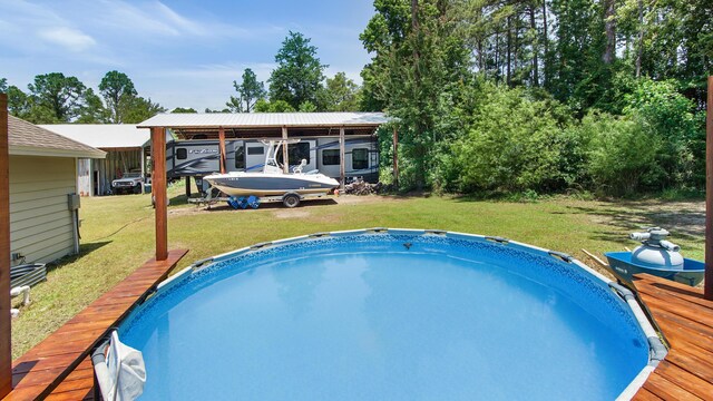241 Mullet Dr, Freeport, FL 32439 - swimming pool featuring a lawn