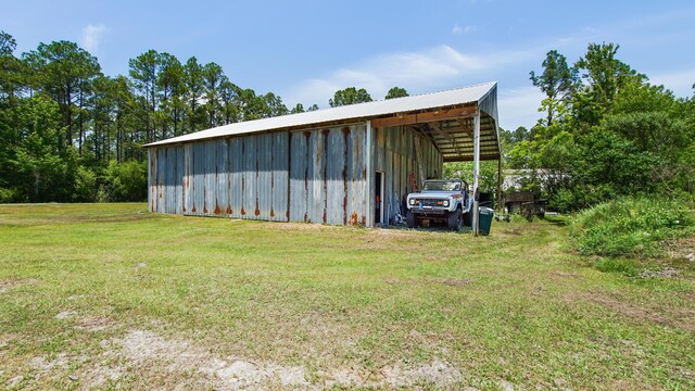 241 Mullet Dr, Freeport, FL 32439 - view of pole building featuring a lawn