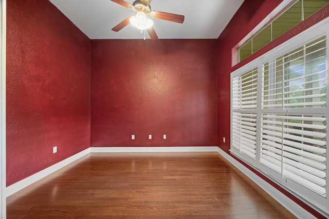 201 Pinque Coat Ct, Crestview, FL 32536 - empty room with wood finished floors, a ceiling fan, and a textured wall