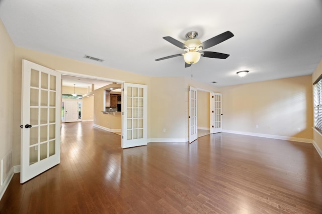 201 Pinque Coat Ct, Crestview, FL 32536 - empty room featuring french doors, wood finished floors, plenty of natural light, and ceiling fan