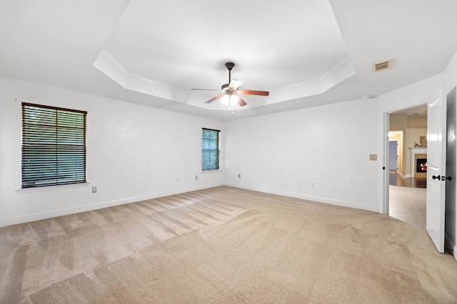 201 Pinque Coat Ct, Crestview, FL 32536 - unfurnished room featuring light carpet, a raised ceiling, ornamental molding, and ceiling fan