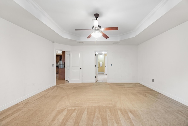 201 Pinque Coat Ct, Crestview, FL 32536 - spare room featuring light carpet, a tray ceiling, ceiling fan, and crown molding