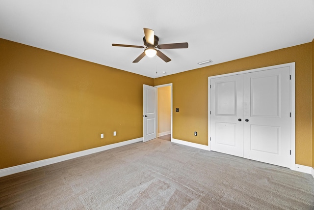 201 Pinque Coat Ct, Crestview, FL 32536 - unfurnished bedroom with carpet, a closet, and a ceiling fan