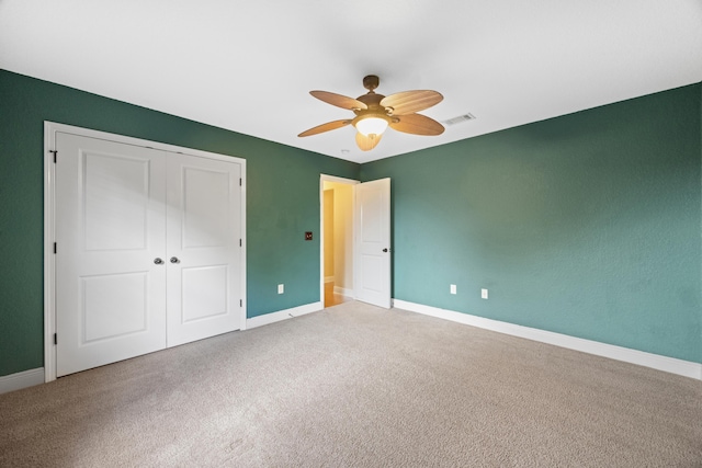 201 Pinque Coat Ct, Crestview, FL 32536 - unfurnished bedroom featuring carpet, a closet, and a ceiling fan