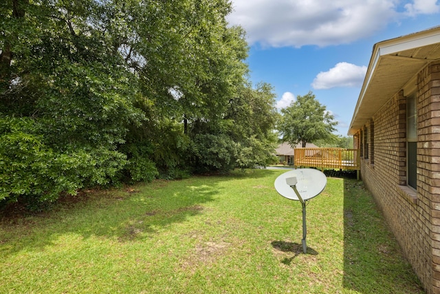 201 Pinque Coat Ct, Crestview, FL 32536 - view of green lawn featuring a wooden deck