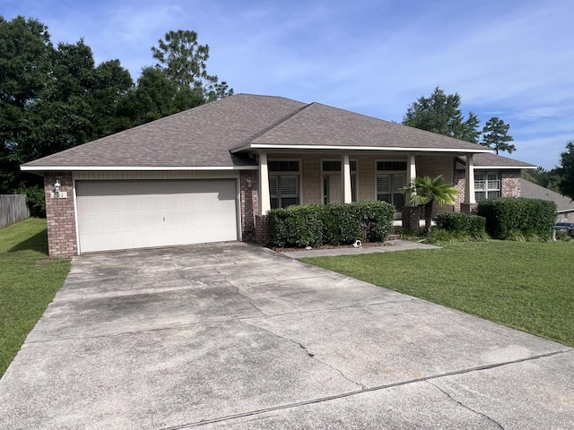 201 Pinque Coat Ct, Crestview, FL 32536 - ranch-style home featuring brick siding, a front yard, and a garage