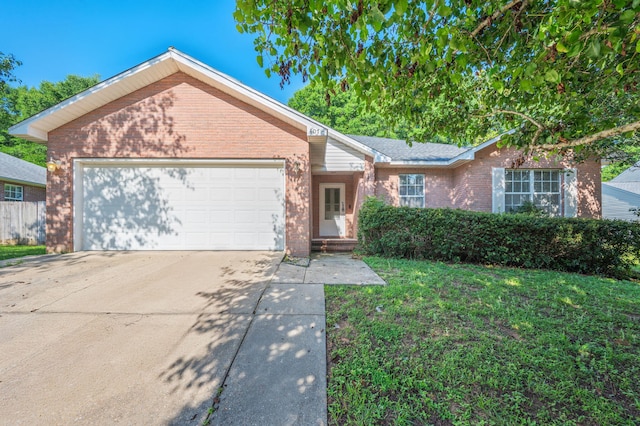 407 Tobago Ct, Crestview, FL 32536 - single story home with brick siding, an attached garage, driveway, and a front yard