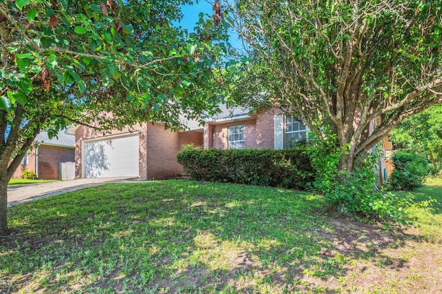 407 Tobago Ct, Crestview, FL 32536 - obstructed view of property featuring brick siding, a garage, a front yard, and concrete driveway