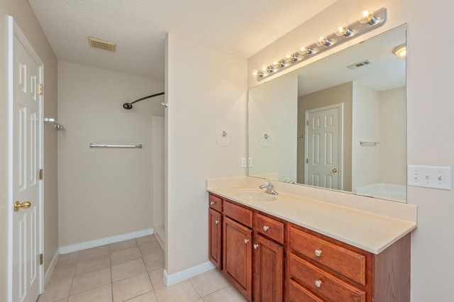 407 Tobago Ct, Crestview, FL 32536 - full bathroom with vanity, a shower, tile patterned floors, and baseboards