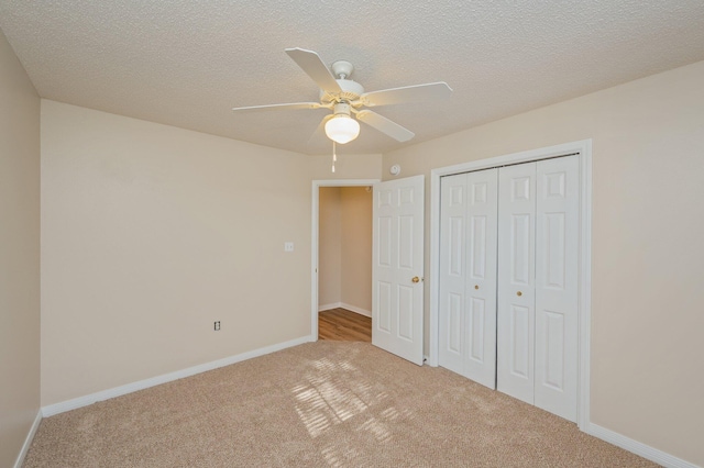 407 Tobago Ct, Crestview, FL 32536 - unfurnished bedroom featuring carpet, a closet, baseboards, and a textured ceiling