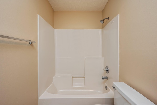 407 Tobago Ct, Crestview, FL 32536 - bathroom featuring toilet, bathtub / shower combination, and a textured ceiling