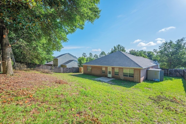 407 Tobago Ct, Crestview, FL 32536 - back of house with a shingled roof and a patio