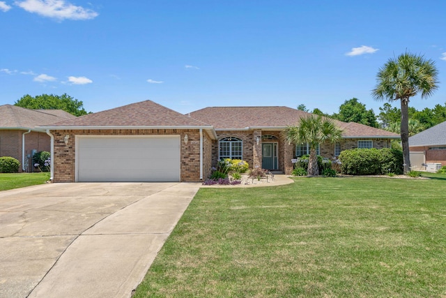 2741 Creeks Edge Ln, Navarre, FL 32566 - ranch-style home with concrete driveway, brick siding, an attached garage, and a front lawn