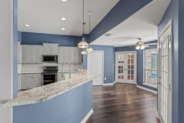 2741 Creeks Edge Ln, Navarre, FL 32566 - kitchen with appliances with stainless steel finishes, french doors, tasteful backsplash, baseboards, and dark wood-style flooring