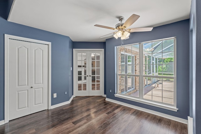 2741 Creeks Edge Ln, Navarre, FL 32566 - unfurnished dining area with french doors, dark wood-style floors, ceiling fan, and baseboards
