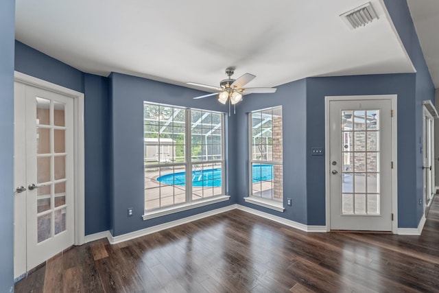 2741 Creeks Edge Ln, Navarre, FL 32566 - unfurnished dining area with wood finished floors, baseboards, and ceiling fan