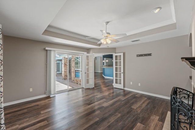 2741 Creeks Edge Ln, Navarre, FL 32566 - unfurnished living room with a tray ceiling, french doors, ornamental molding, and wood finished floors