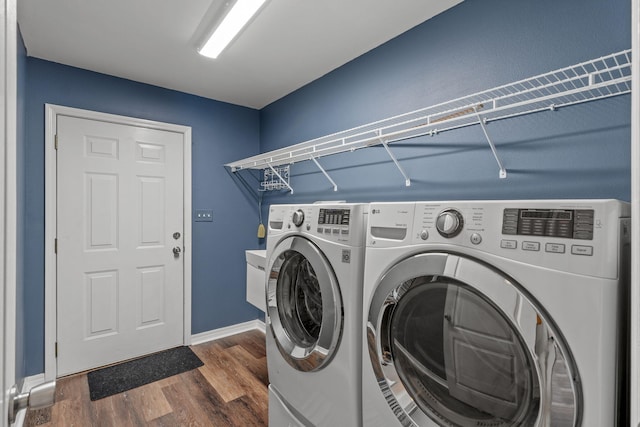 2741 Creeks Edge Ln, Navarre, FL 32566 - washroom featuring independent washer and dryer, dark wood-style floors, and baseboards