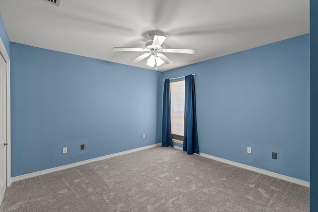 2741 Creeks Edge Ln, Navarre, FL 32566 - empty room featuring a ceiling fan, carpet flooring, and baseboards