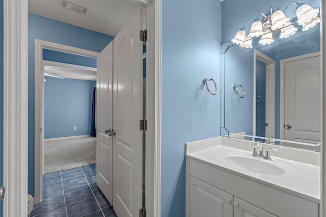 2741 Creeks Edge Ln, Navarre, FL 32566 - bathroom featuring vanity, toilet, tile patterned flooring, and baseboards