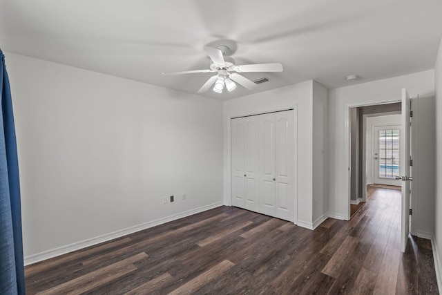 2741 Creeks Edge Ln, Navarre, FL 32566 - unfurnished bedroom with dark wood-style floors, a closet, baseboards, and ceiling fan