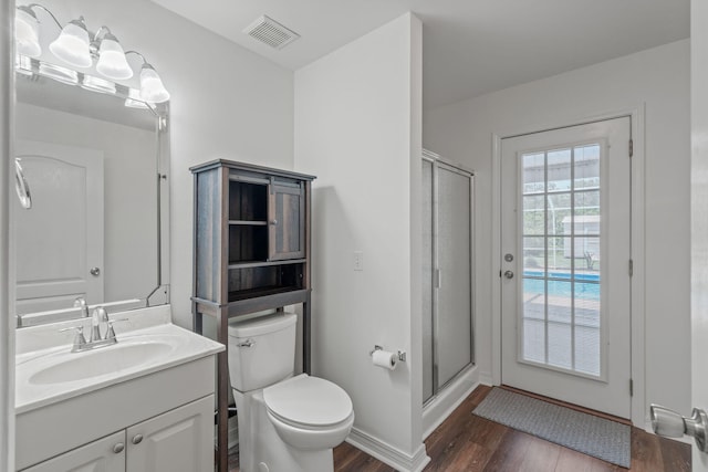 2741 Creeks Edge Ln, Navarre, FL 32566 - full bath featuring wood finished floors, toilet, vanity, a stall shower, and baseboards