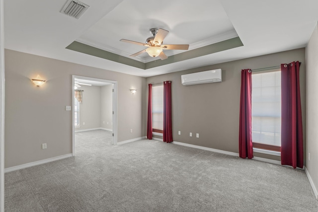 2741 Creeks Edge Ln, Navarre, FL 32566 - carpeted spare room with an AC wall unit, a raised ceiling, ceiling fan, and baseboards